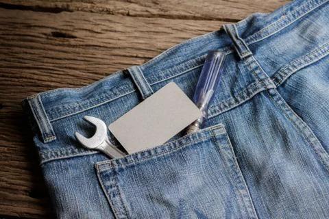 Several tools on a denim workers pocket Stock Photos