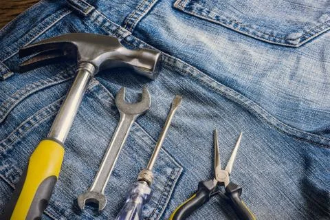 Several tools on a denim workers pocket 스톡 사진
