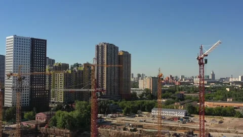 Several tower cranes in the process of building a new residential complex Stock Footage 156353233