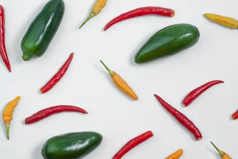 Several types of peppers on the white background Stock Photos