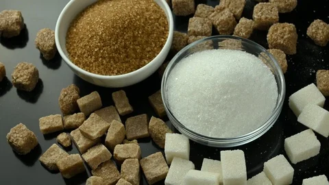 Several types of sugar spinning on black table Stock Footage 127362865
