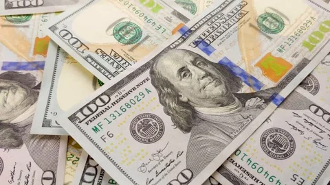 Several various Dollar banknotes placed in a stack while rotating in the frame. Stock Footage 123414006