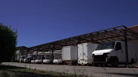 Several vehicles placed there solely for spare parts, located behind a resort Stock Footage 306364398