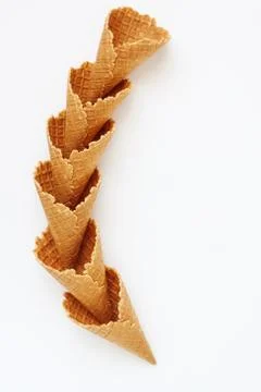 Several waffle cones lined in tower, smile, or even row, top vie Stock Photos