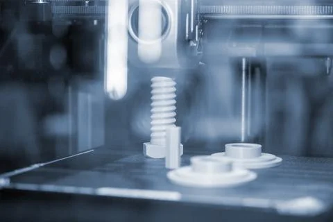 Several white objects working surface inside 3D printer Model printed 3D printer Stock Photos