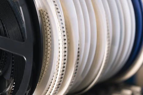 Several white tapes with SMD electronic parts waiting to be used by SMD montage Stock Photos