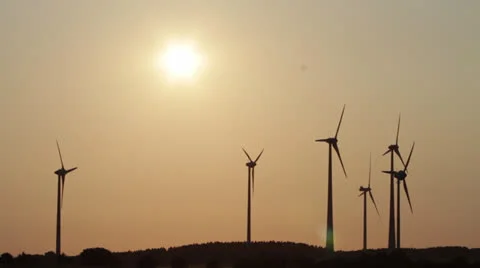 Several wind generators in sunset lighting Stock Footage 25605180