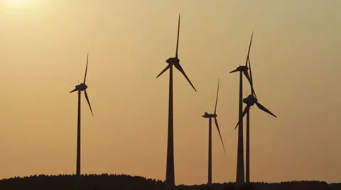 Several wind generators in sunset lighting Stock Footage 25605569
