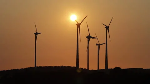 Several wind generators in sunset lighting Stock Footage 25606883