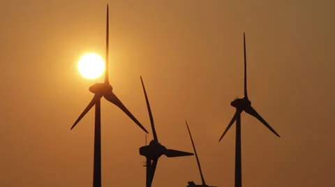 Several wind generators in sunset lighting Stock Footage 25607406