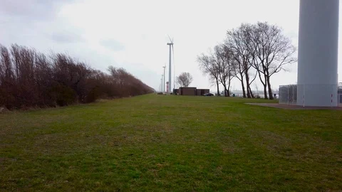 Several wind turbines on a cloudy windy day Stock Footage 104310120