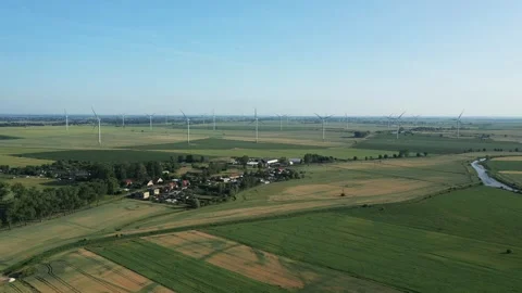 Several wind turbines (windmill) are spinning on the field, taken from a drone, Stock Footage 245482190