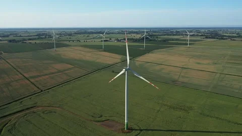 Several wind turbines (windmill) are spinning on the field, taken from a drone, Stock Footage 245482945