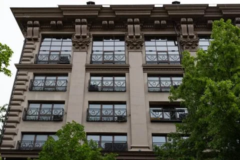 Several Windows in a row on the facade of the old building. Windows in a row Stock Photos