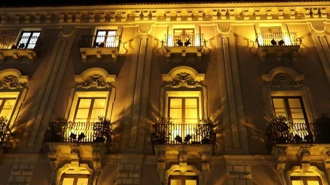 Several windows in a row on night illuminated facade Stock Footage 103536180
