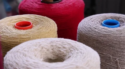 Several wool rolls of different colors for sewing Stock Footage 56526836