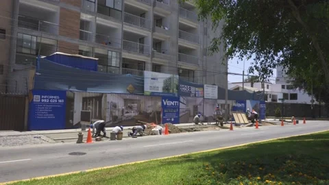 Several workers constructing the entrance of a building on the street Video stock 150679069