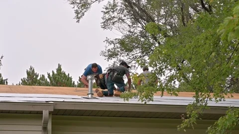 Several workers roofing a house Stock Footage 164813628