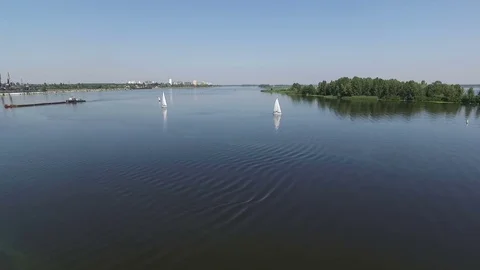 Several yachts sail along the river. Aerial view. Stock Footage 82472016