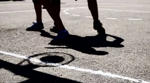 Several young man playing basketball, feet, abstract concept Stock Footage 51553042