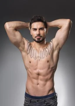 Severe bodybuilder posing without shirt Stock Photos