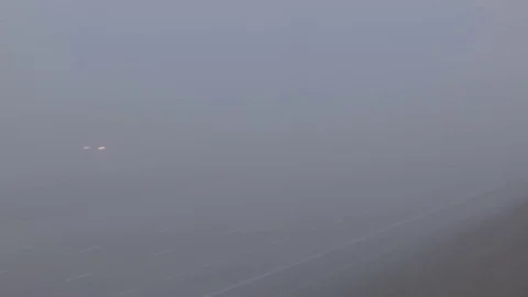 Severe fog with drivers driving in zero visibility on highway Stock Footage 71664370
