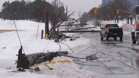 Severe spring ice snow and wind storm takes down hydro poles in city of Toronto Stock Footage 88563786