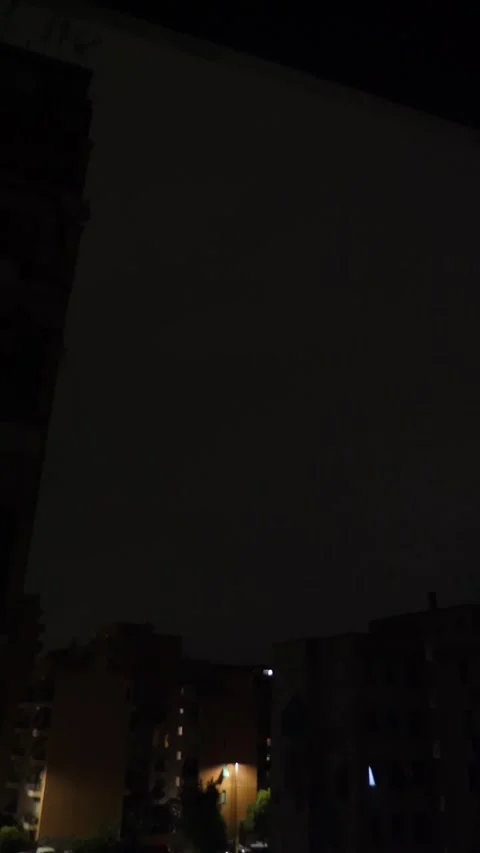 Severe storm with lightning strikes illuminating the cityscape Stock Footage 285534977