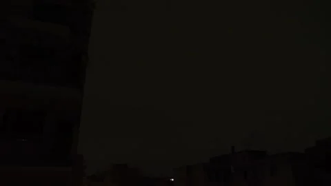 Severe storm with lightning strikes illuminating the cityscape Stock Footage 285534978