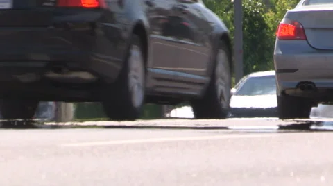 Severe summer heat waves rising from the pavement with traffic in city Stock Footage 63815674