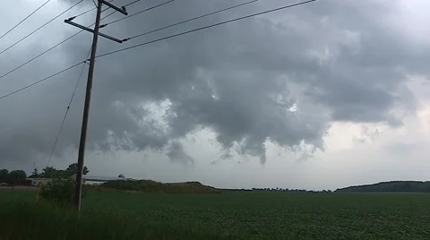 Severe thunder storm heavy rain and swirling clouds approaches crops on farm. Stock Footage 44382569