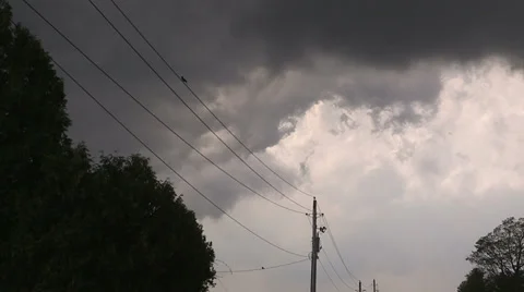 Severe thunderstorm and storm clouds approach with tornado warning in effect Stock Footage 38516416