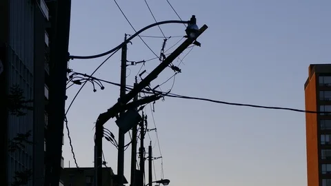 Severe thunderstorm and wind damage to power poles and electrical grid in city Stock Footage 90980518