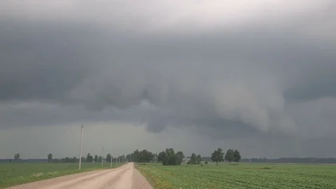 Severe thunderstorm with rain wrapped tornado approaching Hawksville Canada Stock Footage