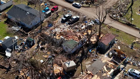 Severe tornado aftermath captured by drone revealing destroyed homes and Stock Footage 331030773