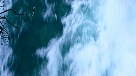 Severe waterfall stream flowing moving branch in the front Stock Footage 121520646