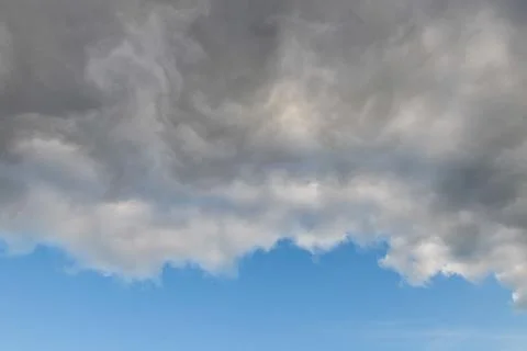 Severe weather cloud front advancing on a blue sky Stock Photos