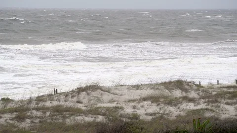 A severe windy tropical storm with rough surf on Amelia Island in Florida Stock Footage 129268417