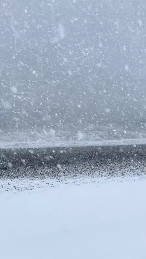 Severe winter snowstorm over rough sea with high waves during blizzard. Stock Footage 319146062