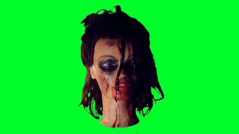 Severed head on a green screen Stock Footage 75879395