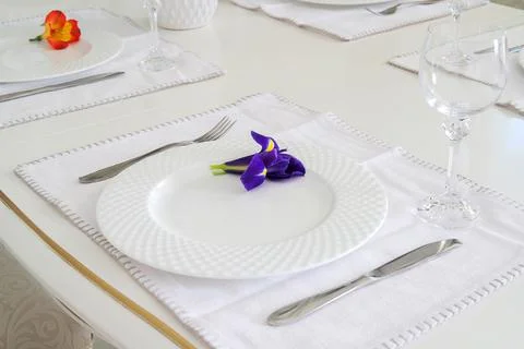 Severed table with white plate and wineglass Stock Photos