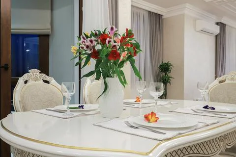 Severed table with white plates and wineglasses Stock Photos