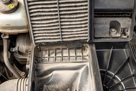Severely Clogged Engine Air Filter During Replacement Procedure Fotos de archivo