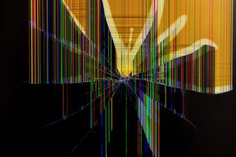 Severely cracked digital screen displaying colorful vertical lines and shat.. Foto stock