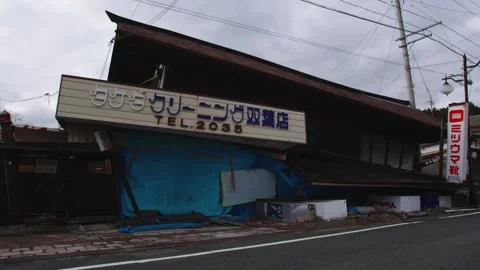 Severely Damaged Collapsed Building Aftermath in Japan Stock Footage 336601298