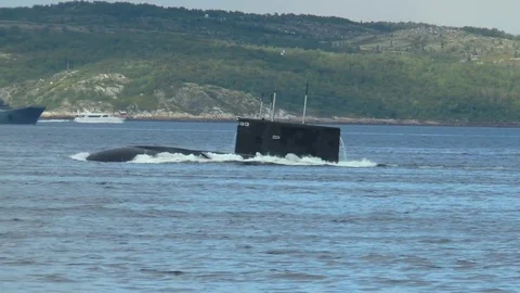 SEVEROMORSK, RUSSIA. Day of the Navy. The submarine emerges from under  water. Stock Footage