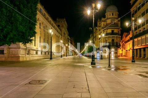 Sevilla. Constitution Avenue at night. Stock Photos