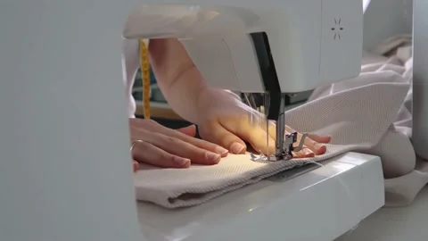 Sew clothes on a sewing machine. Stock Footage 138142416