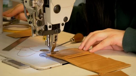 Sew leather wallet, sewing machine, leather workshop Stock Footage