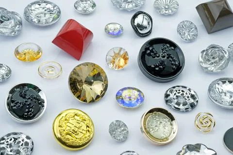 Sew-on plastic buttons of various types and sizes. Stock Photos